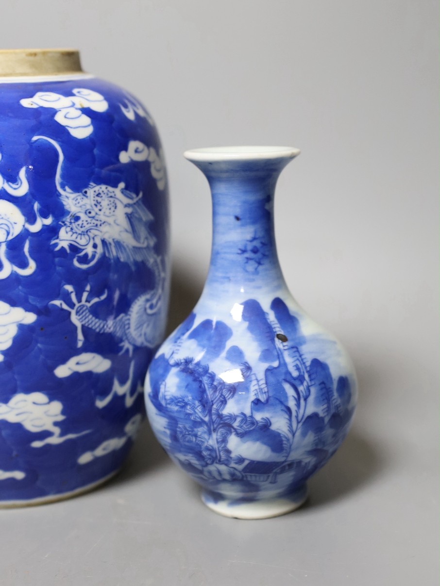 A 19th century Chinese famille rose rice bowl, cover and stand, together with a blue and white dragon jar and similar bottle vase. Largest 18cm